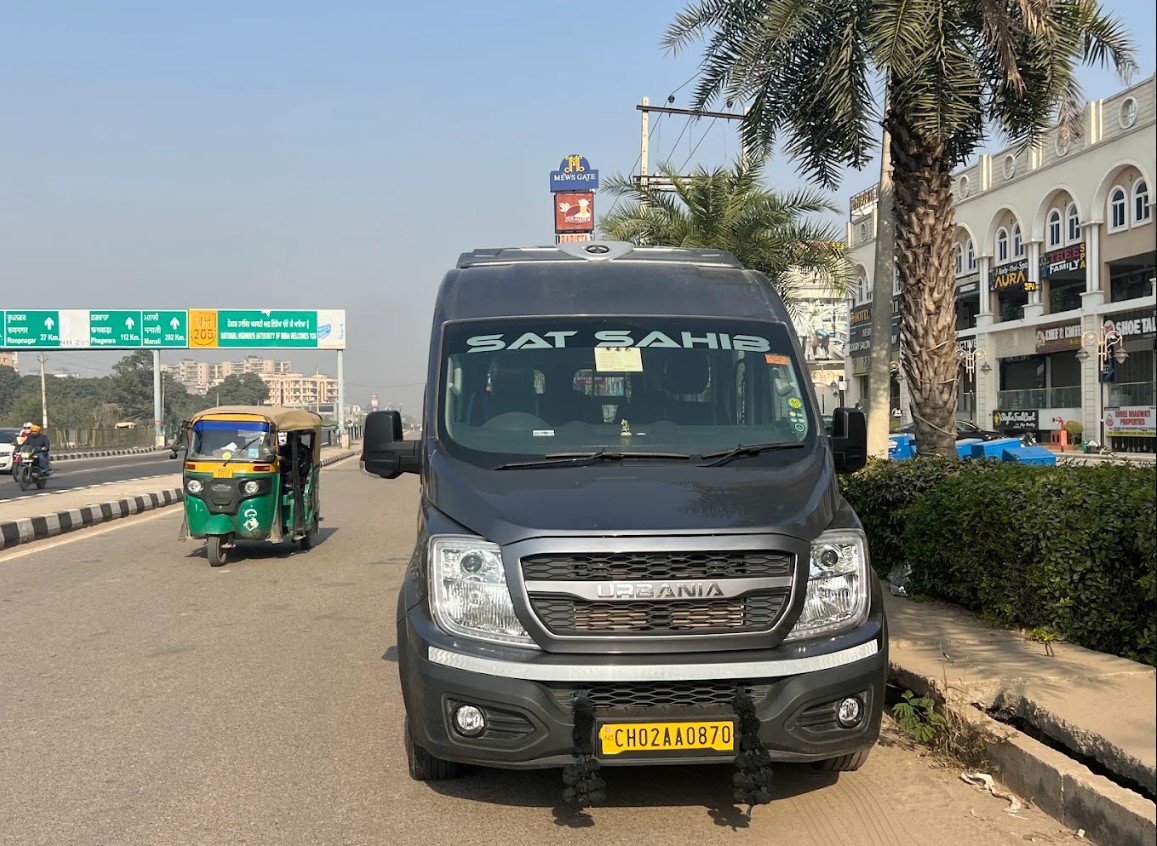 Premium white Force Urbania exterior parked in front of Chandigarh landscape